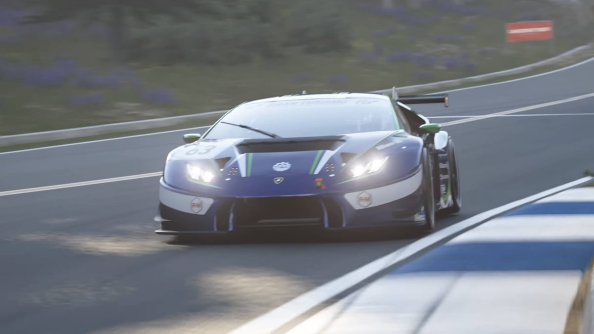 A car racing around a track in Gran Turismo 7