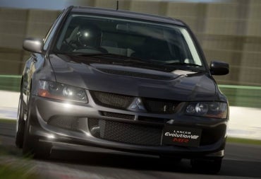 A Mitsubishi Lancer Evolution driving towards the camera in Gran Turismo 7 Update 1.52